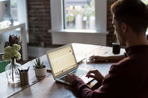 man on laptop doing work