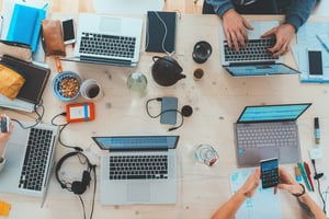 header mobility management laptops and devices on office desk