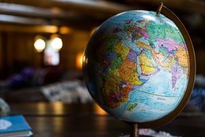globe on conference table with blurred background